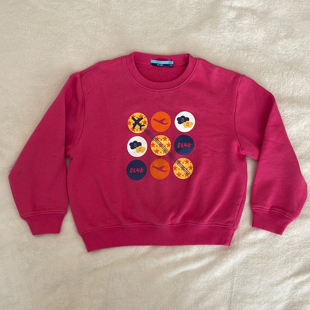 Pink sweater.